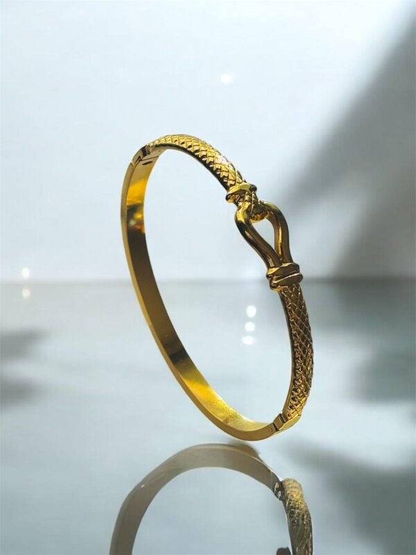 Elegant Gold Textured Bangle with Clasp Detail