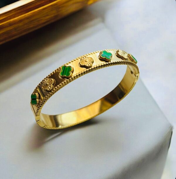 Gold Bangle with Green Gemstone and Floral Motif Accents