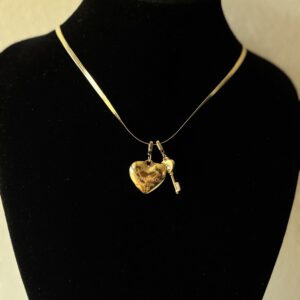 Golden T heart and key
